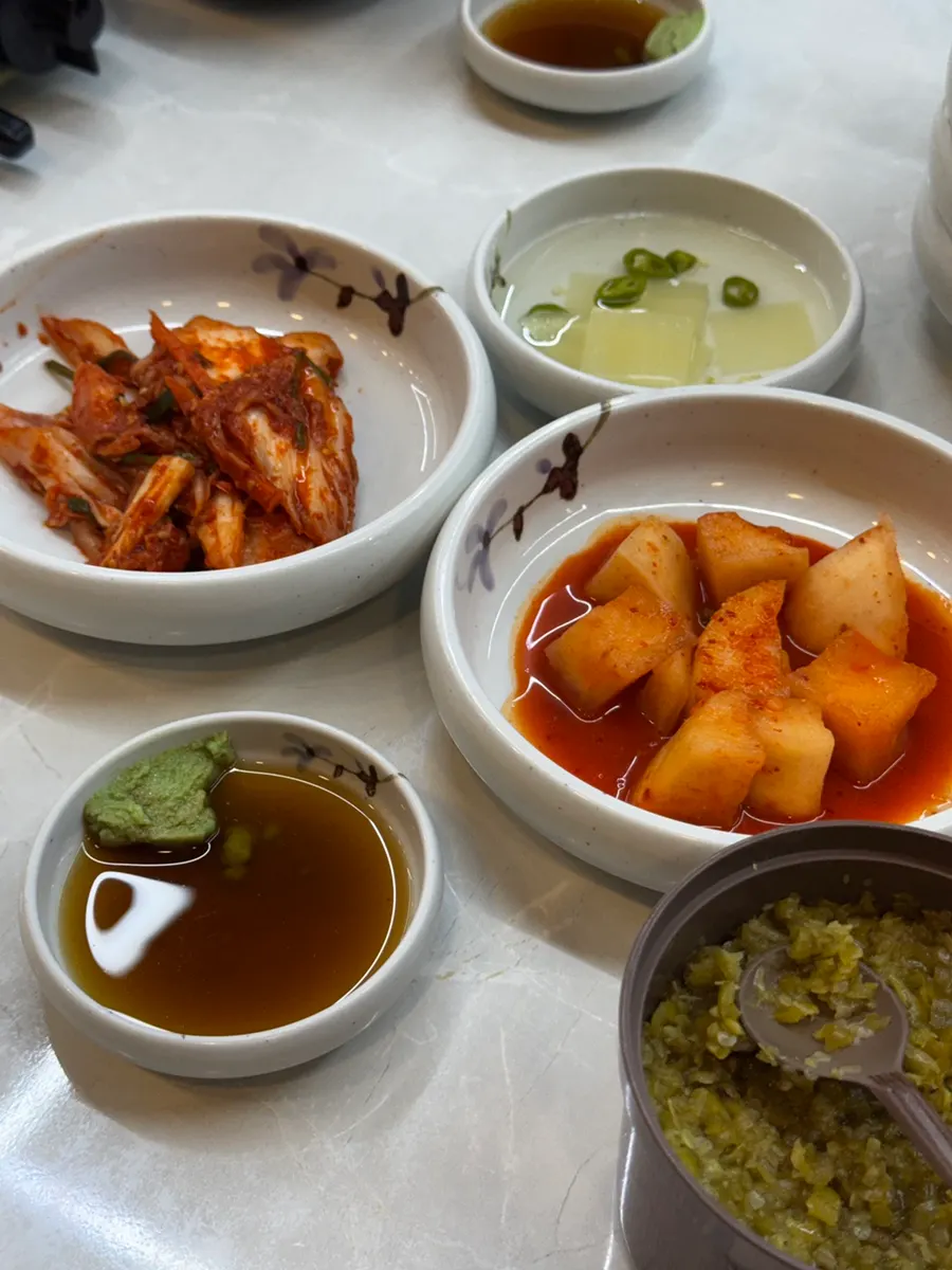 Table set with kkakdugi and geotjeori side dishes