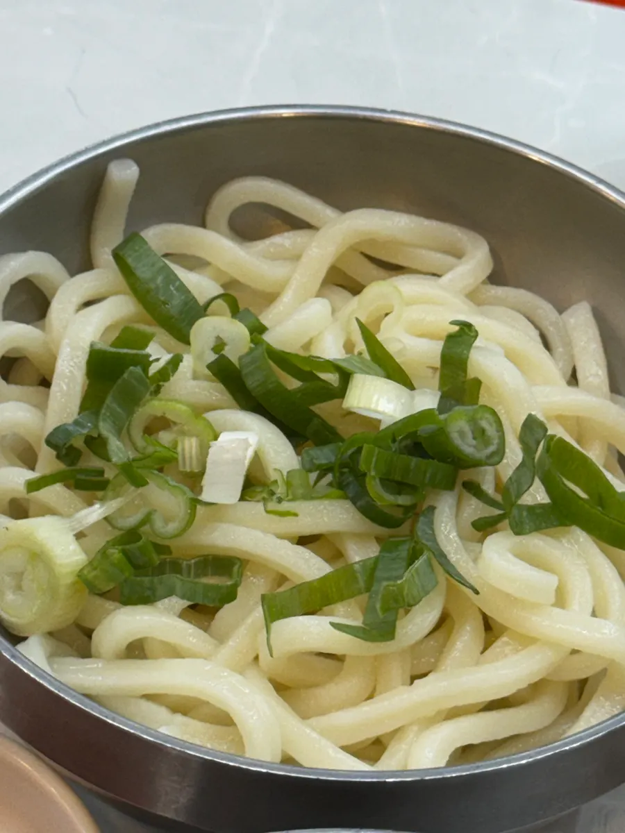 Udon noodles served alongside the beef offal hot pot