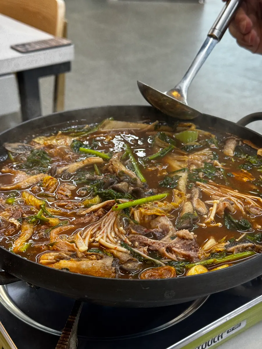 Beef offal hot pot starting to boil over the burner