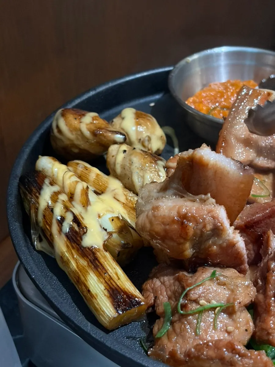A full spread with doenjang stew and seasoned BBQ