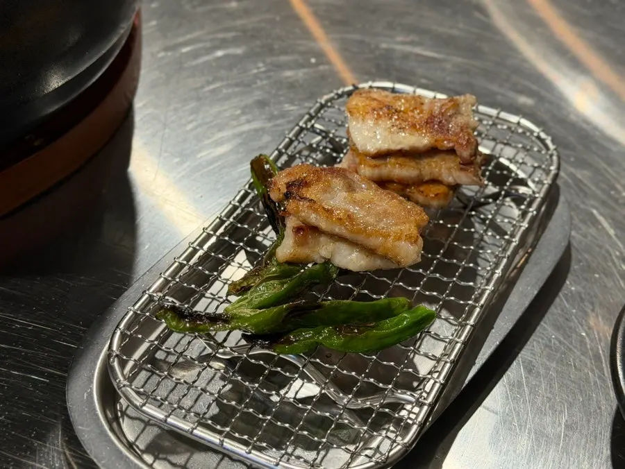 Meat grilled and cut by staff