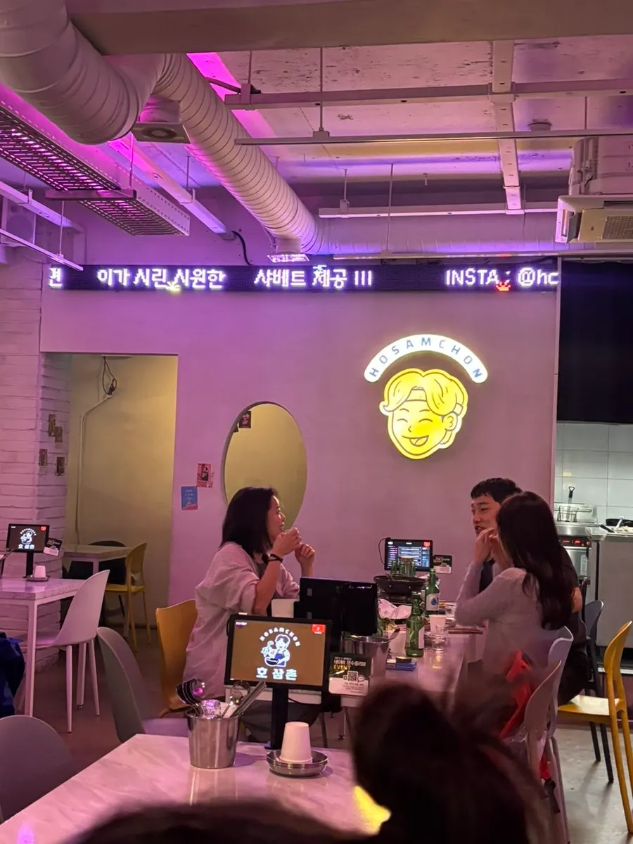 Bar interior with generous space between tables