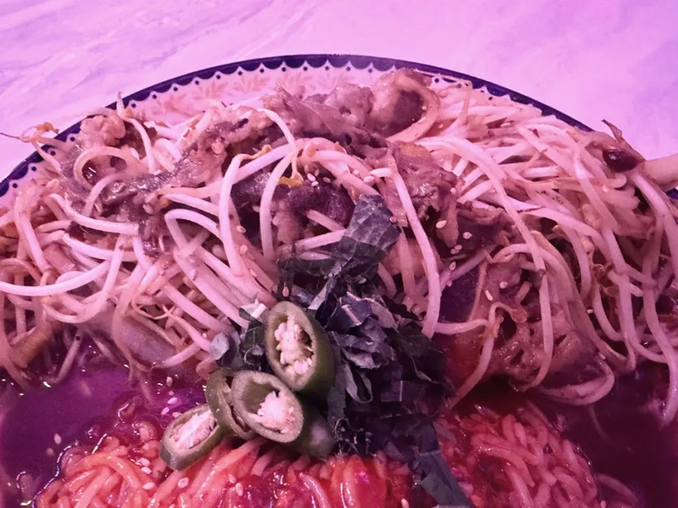 Half bibim noodles and half stir-fried beef brisket with sprouts