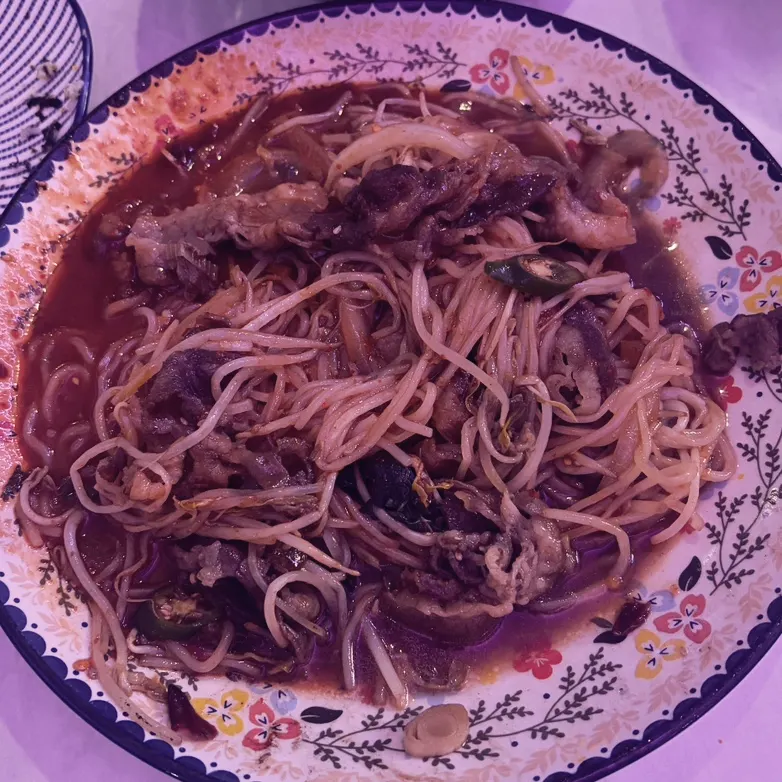Bibim noodles mixed with stir-fried beef brisket and sprouts