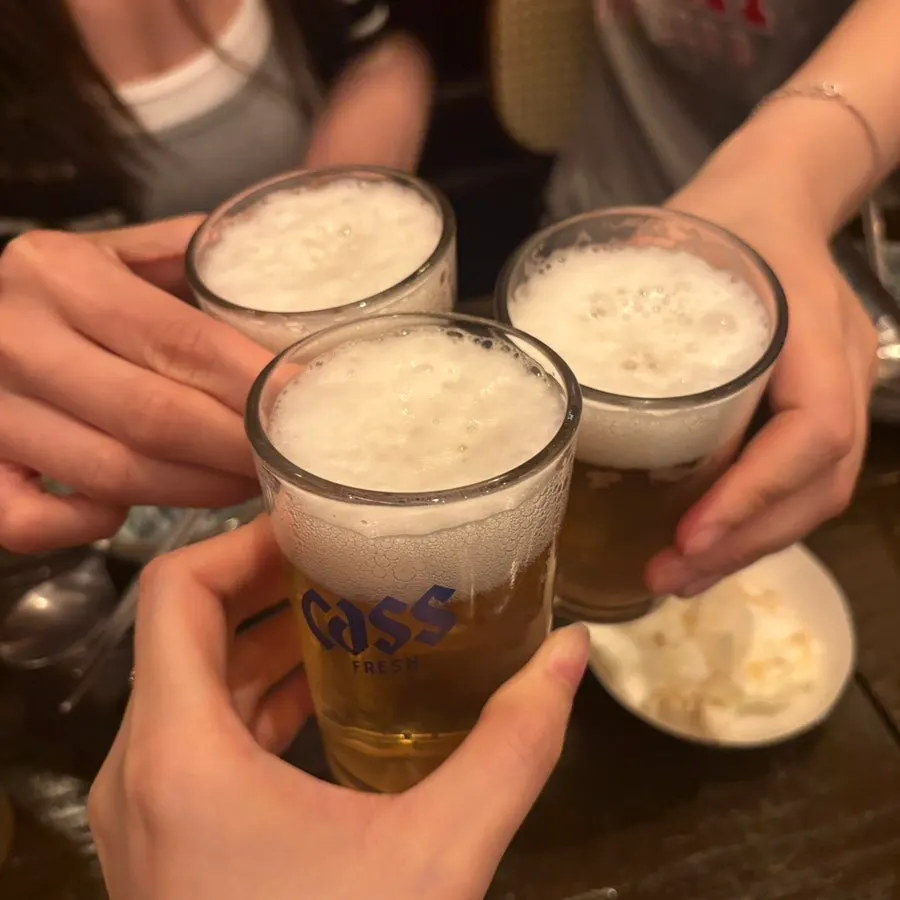 A glass of chilled beer served at the table