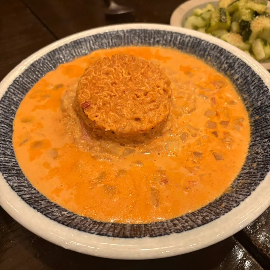 Sinramyeon risotto topped with a sinramyeon instant cup