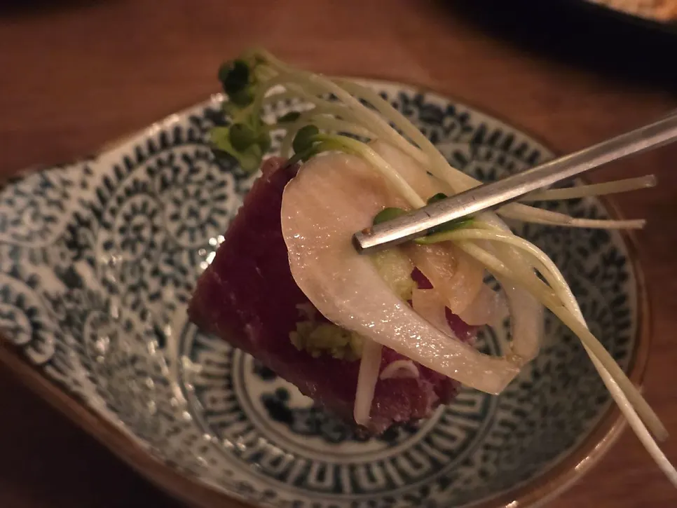 Beef tataki topped with garlic flakes