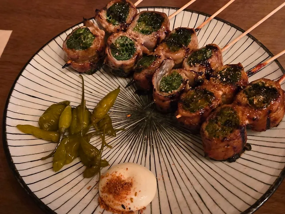 Close-up of pork belly skewer with scallions