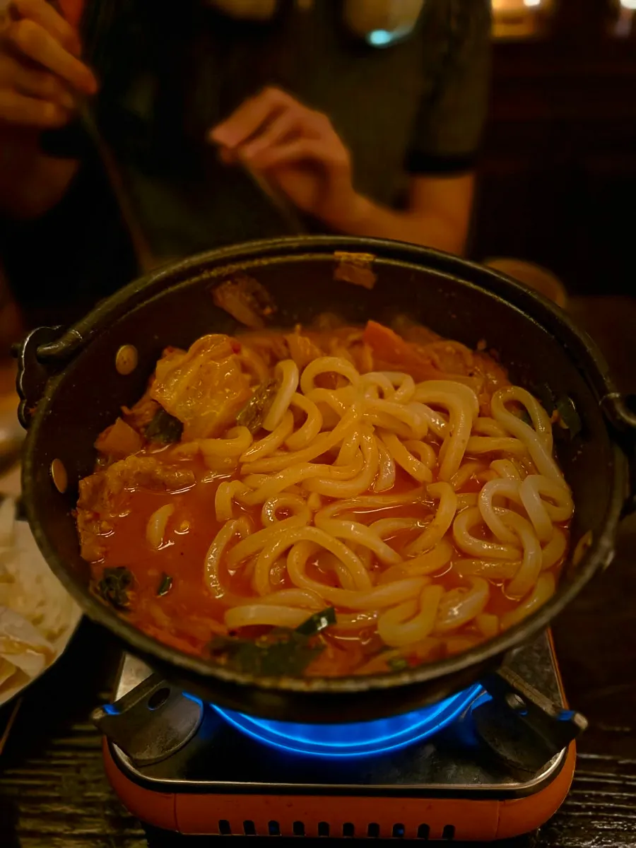 Udon noodles added to the beef brisket nabe