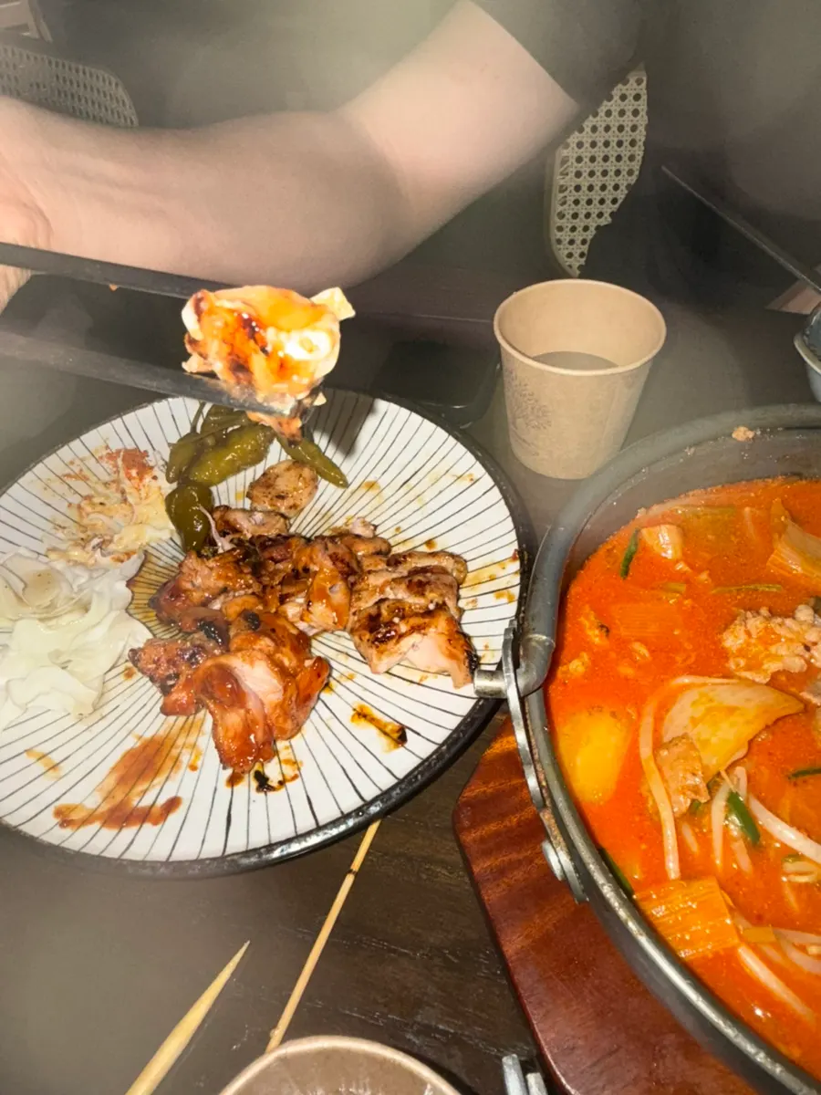 Chicken skewers served with mayo and cabbage