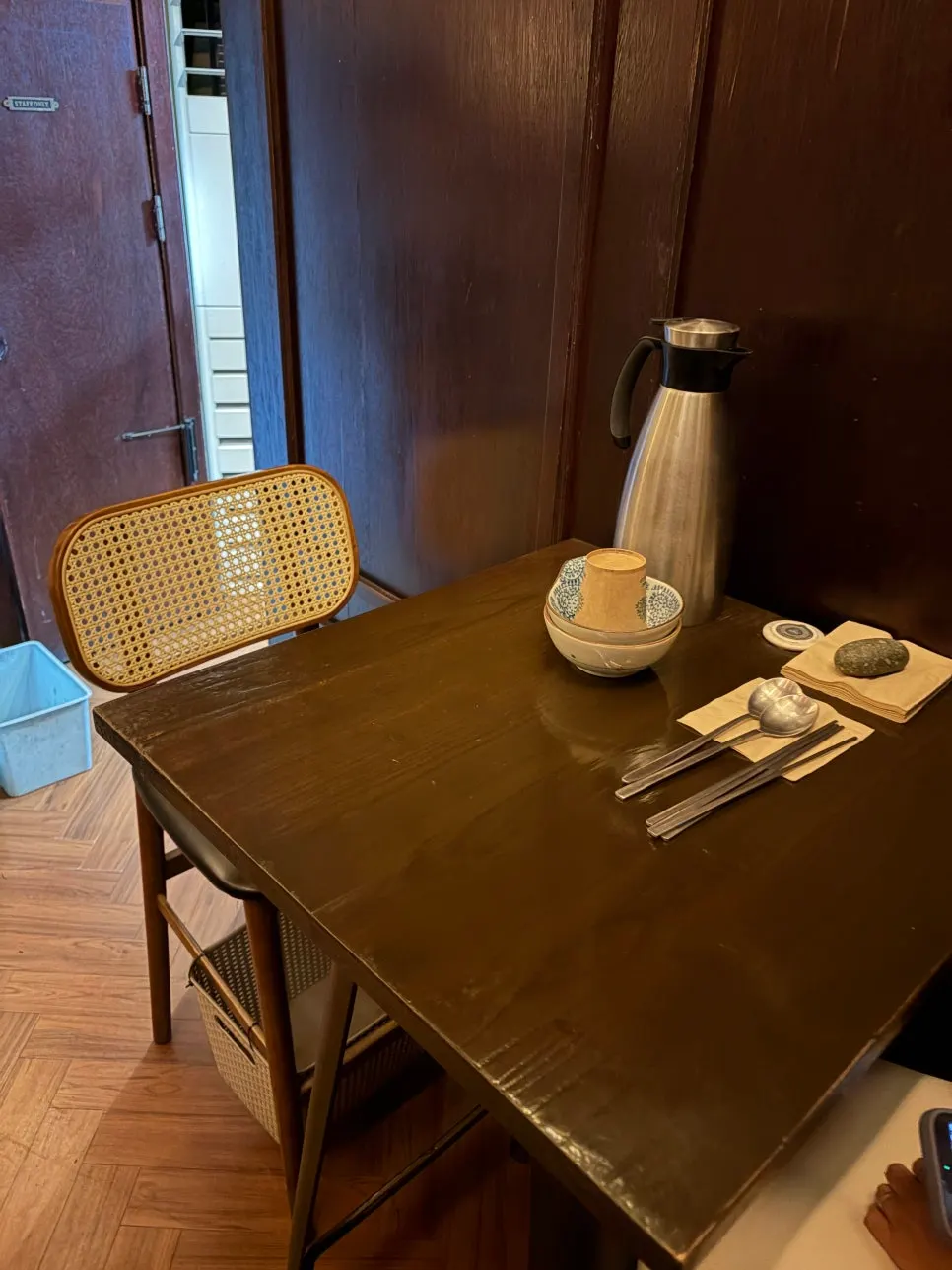Interior of the izakaya with bar seats surrounding the kitchen