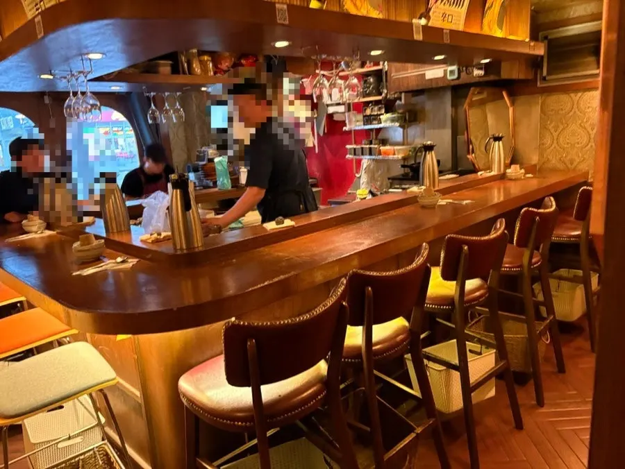 1st-floor bar seats with a view of the kitchen