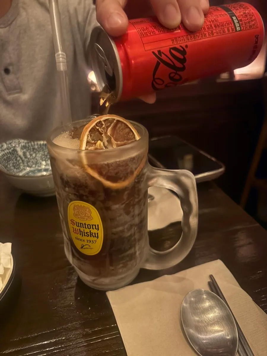 Cola poured into a highball glass
