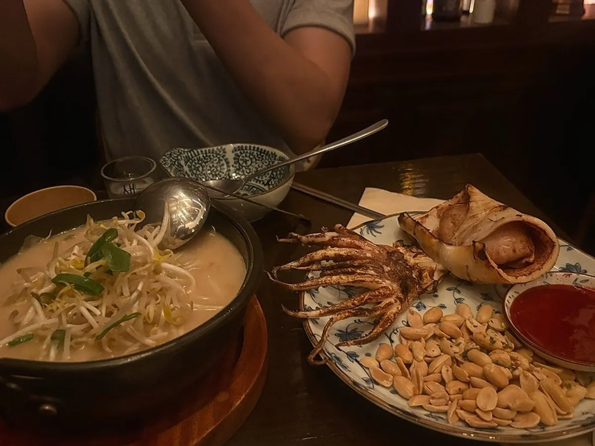 Table set with both the seafood nabe and the semi-dried squid