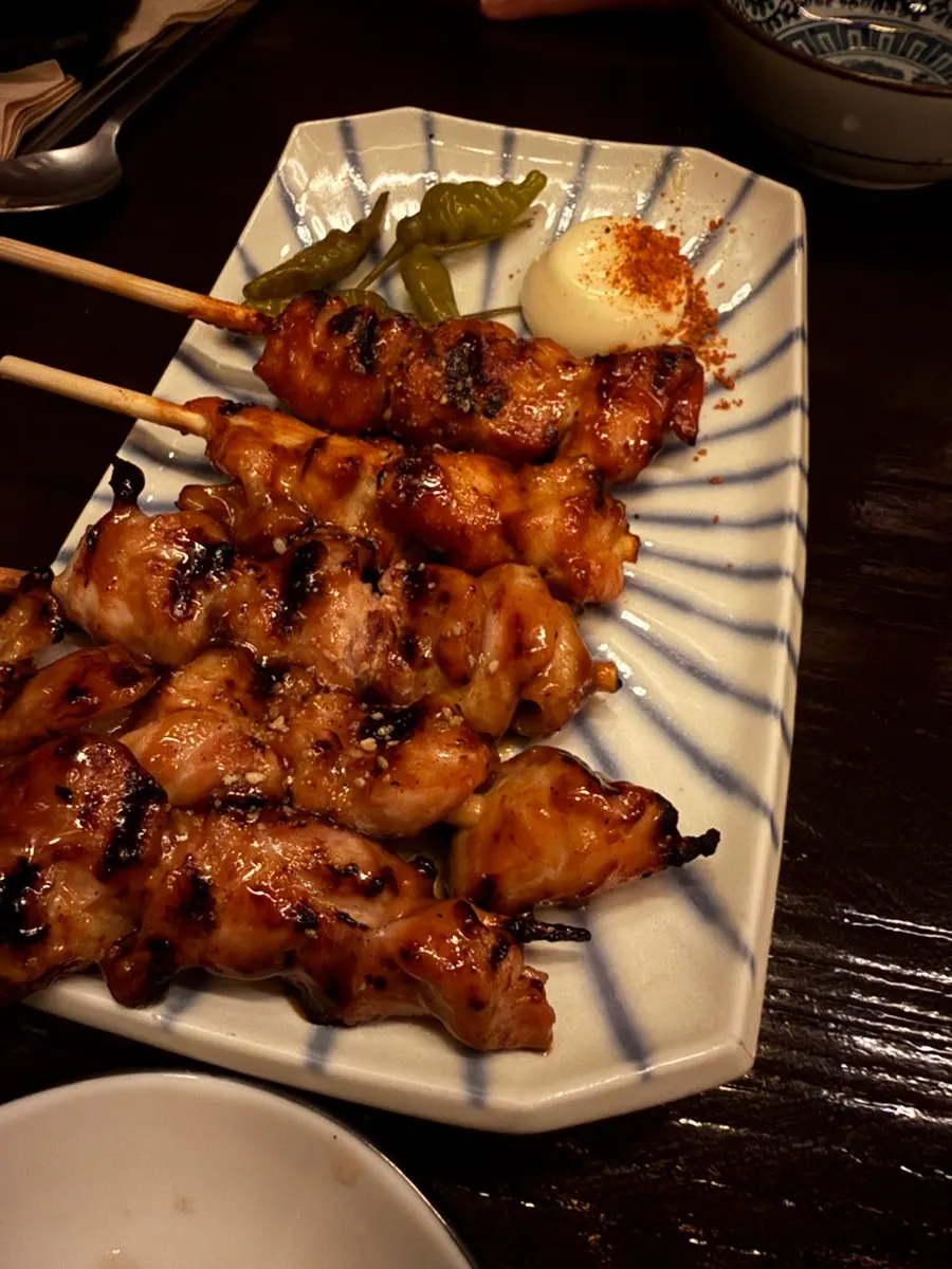 Grilled mentaiko served alongside beer
