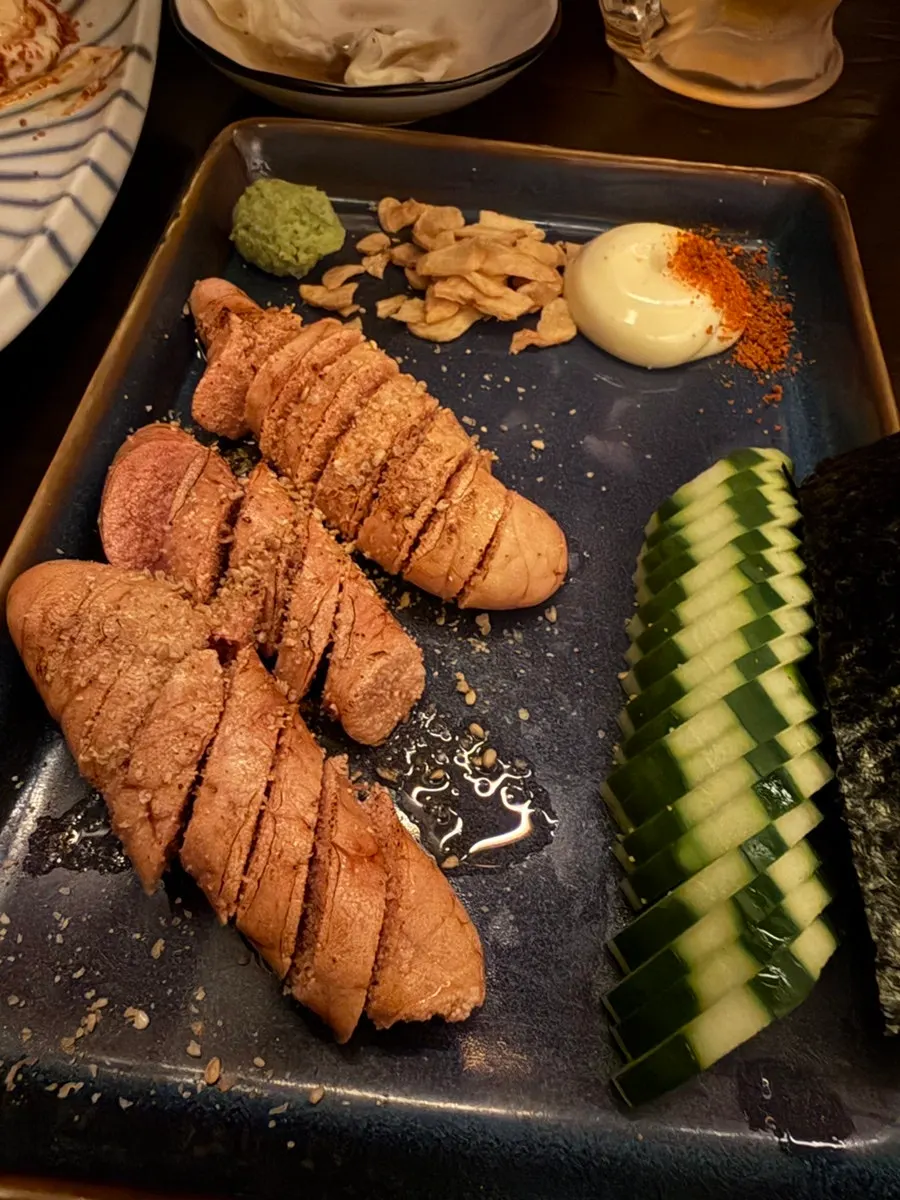 Table with skewers and grilled mentaiko