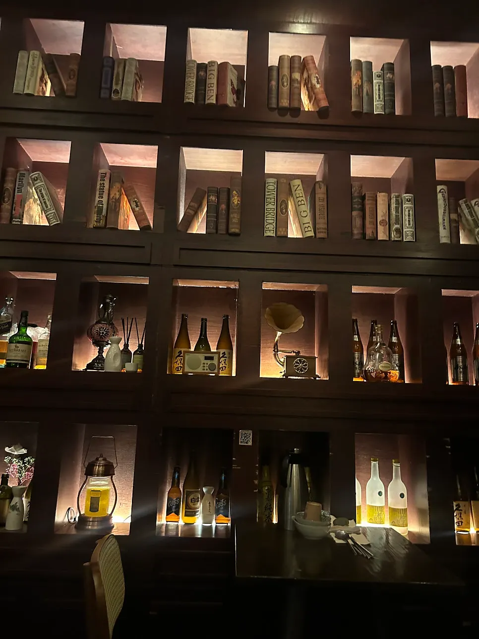Interior of the izakaya lit with soft lighting