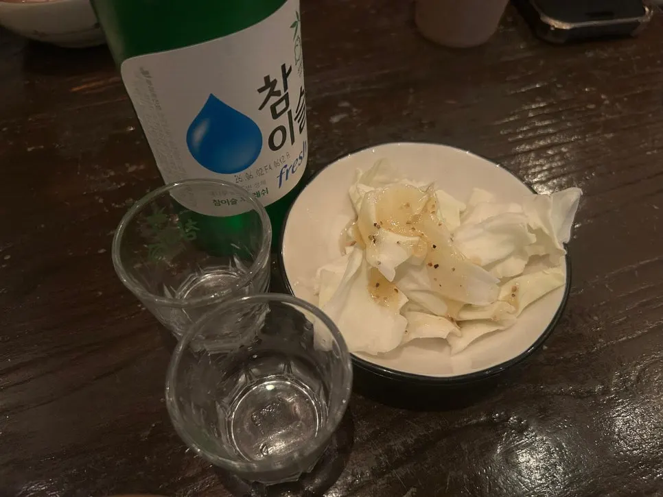 Table with ordered snacks and soju