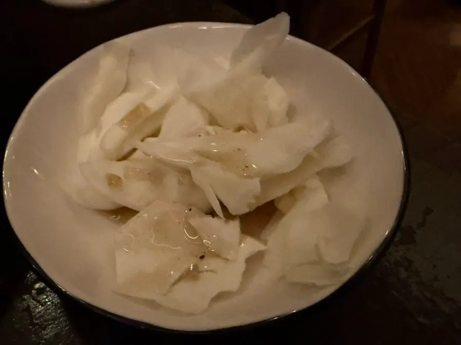 House side dish of cabbage drizzled with sauce