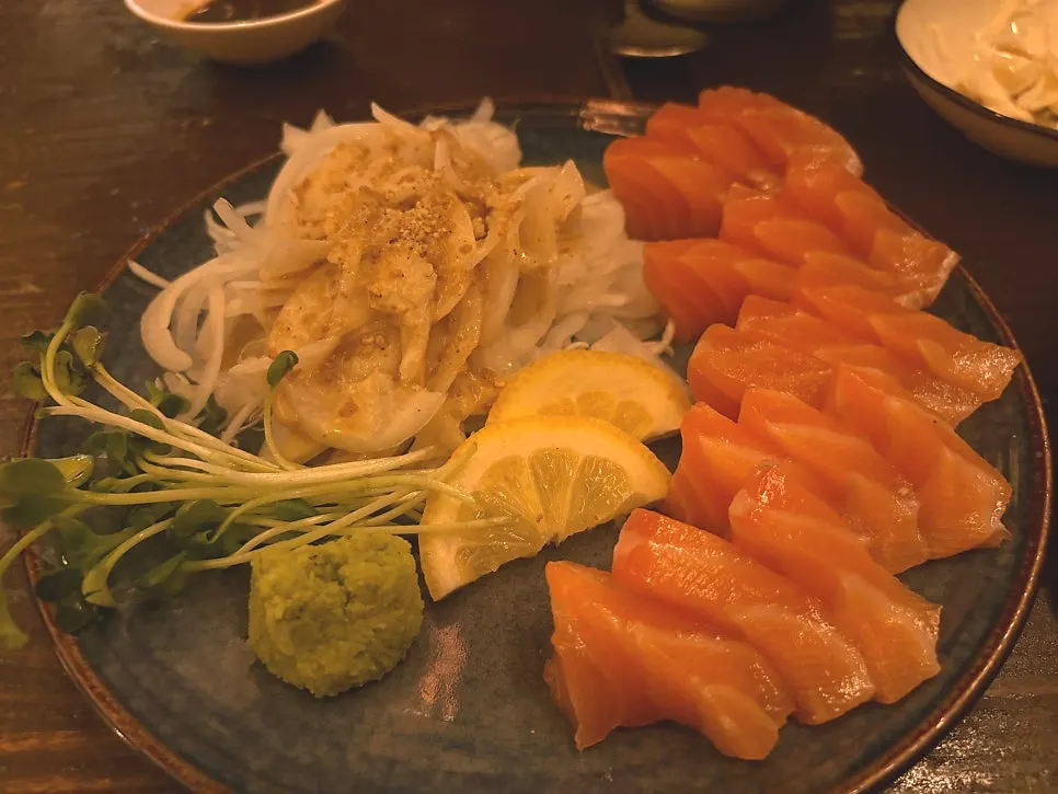 A plate of Nani Byeolgwan salmon sashimi