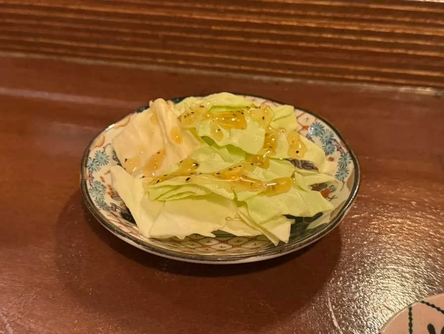Cabbage salad served as the complimentary side dish