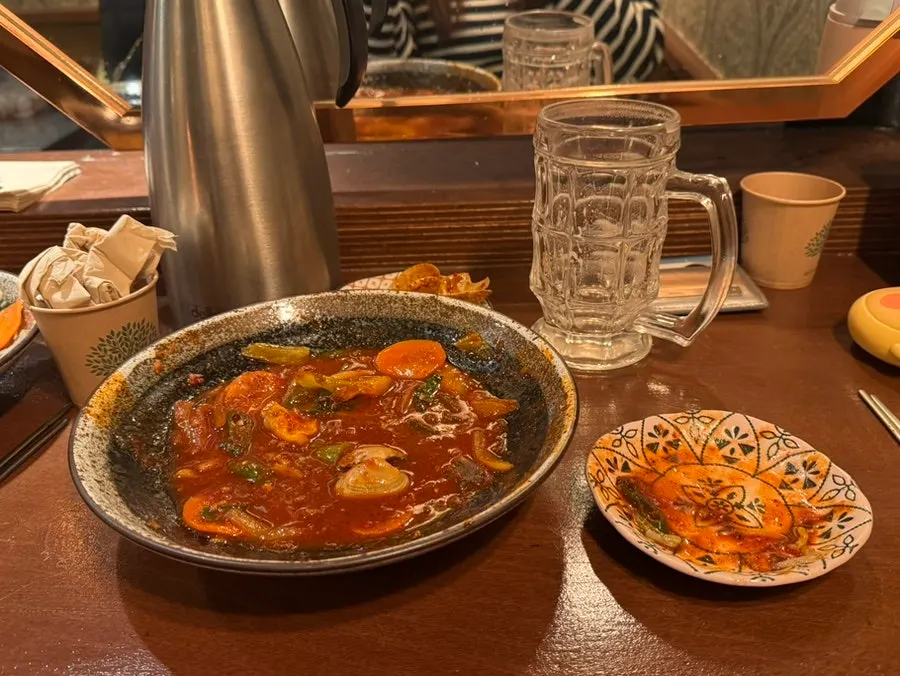 Spicy seafood yaki udon with clams and squid