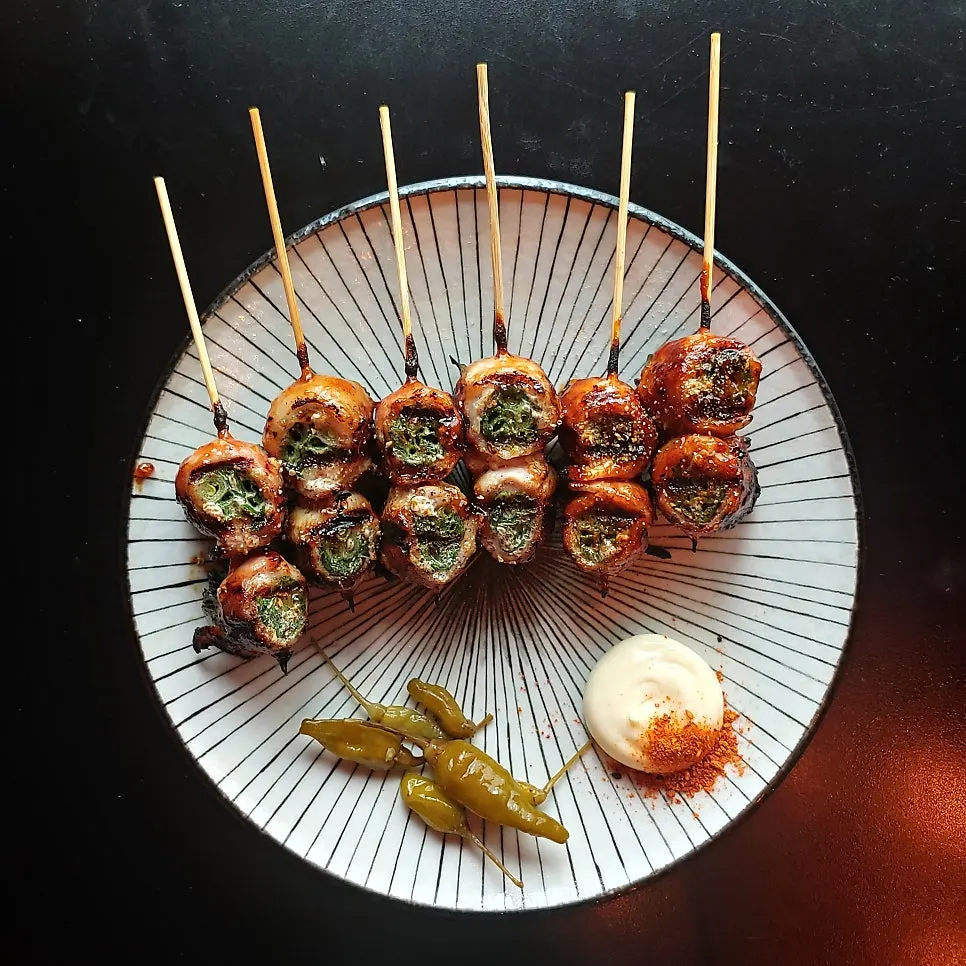 Plate of pork belly scallion skewers at Nani Byeolgwan