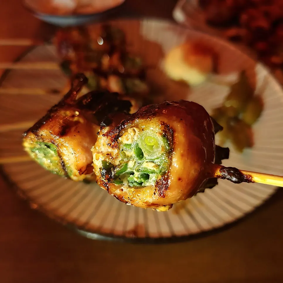 Cross-section of a grilled pork belly scallion skewer