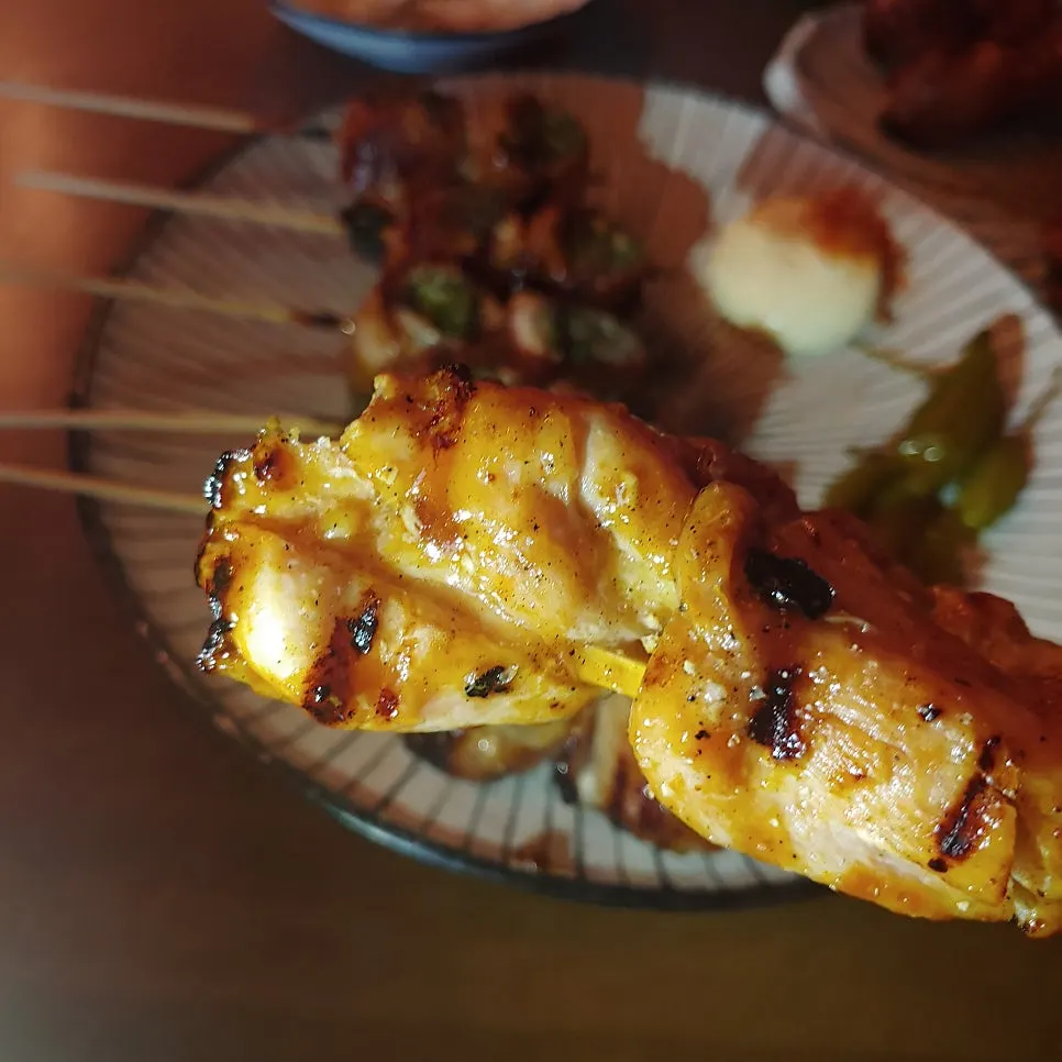 Smoky chicken skewers on the drinking table