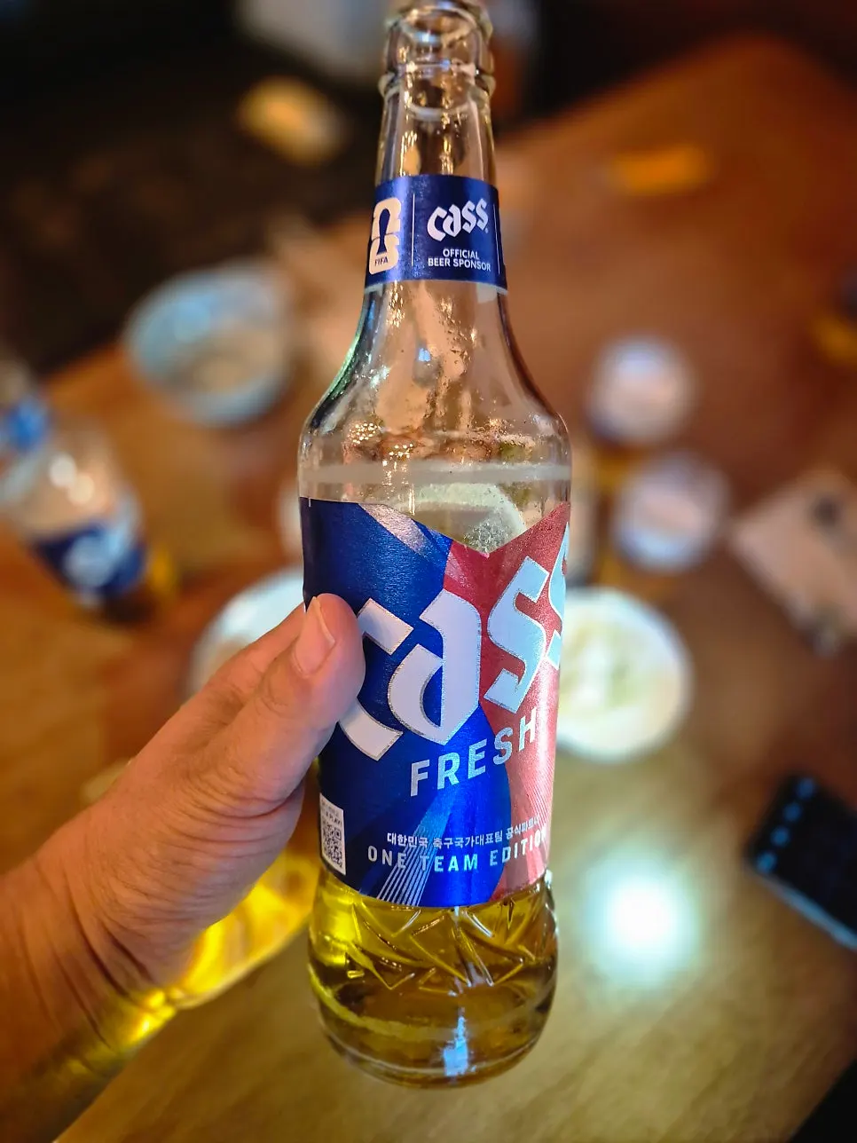 Chilled bottled Cass beer with a glass