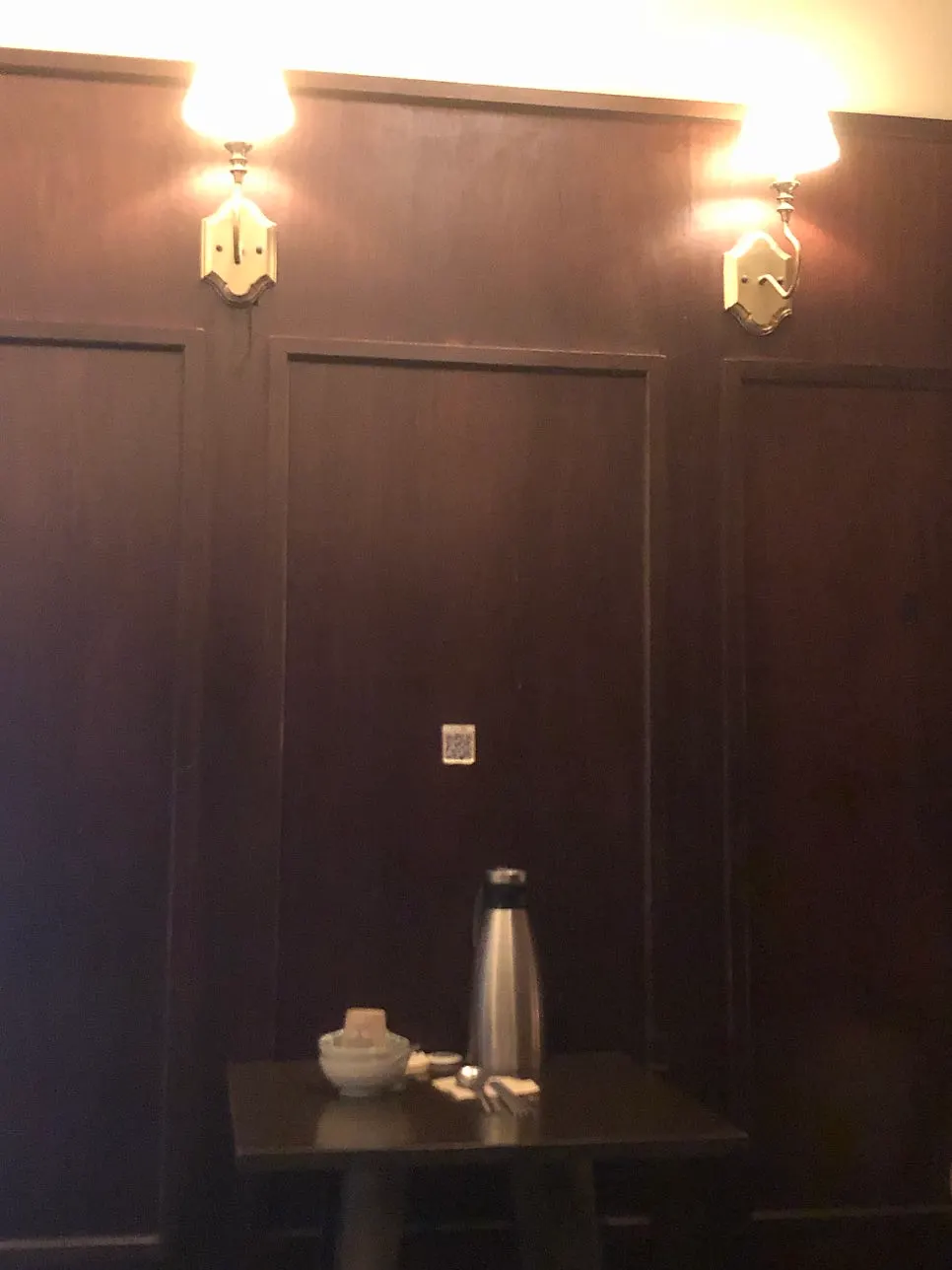 Dimly lit, wood-toned interior of the izakaya
