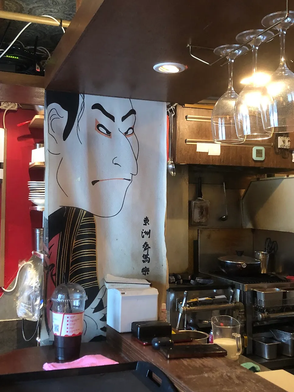 Wall decorated with bottles and Japanese-style props