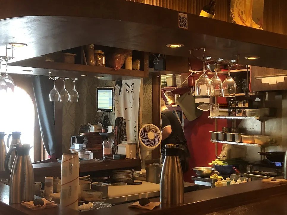 Izakaya seating with generous space between tables