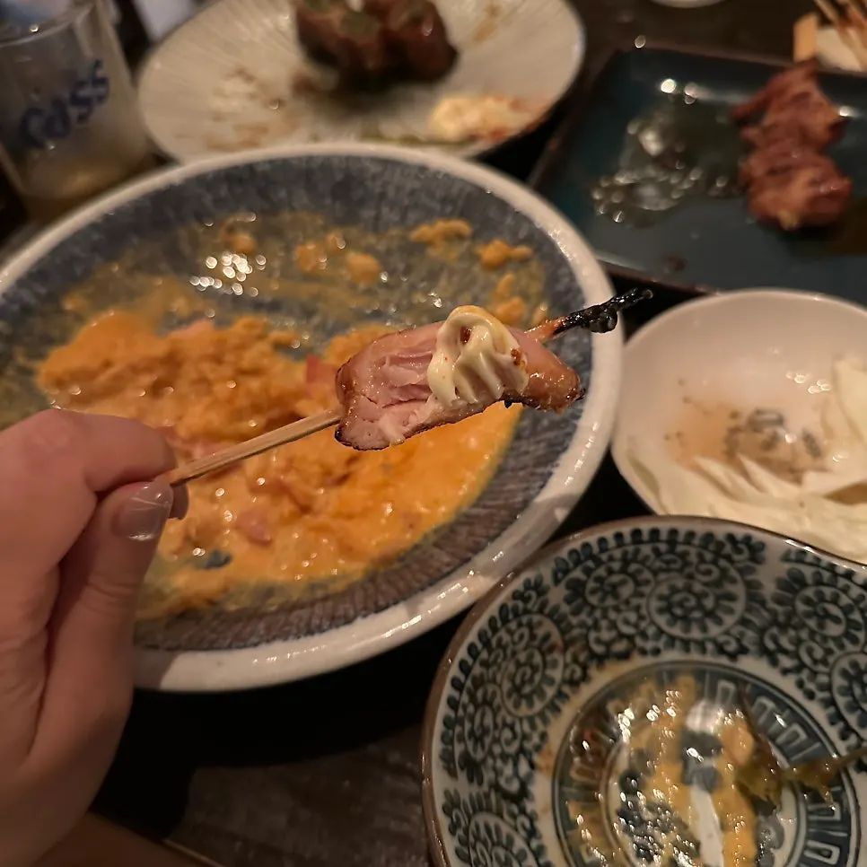 Chicken skewer dipped in sauce