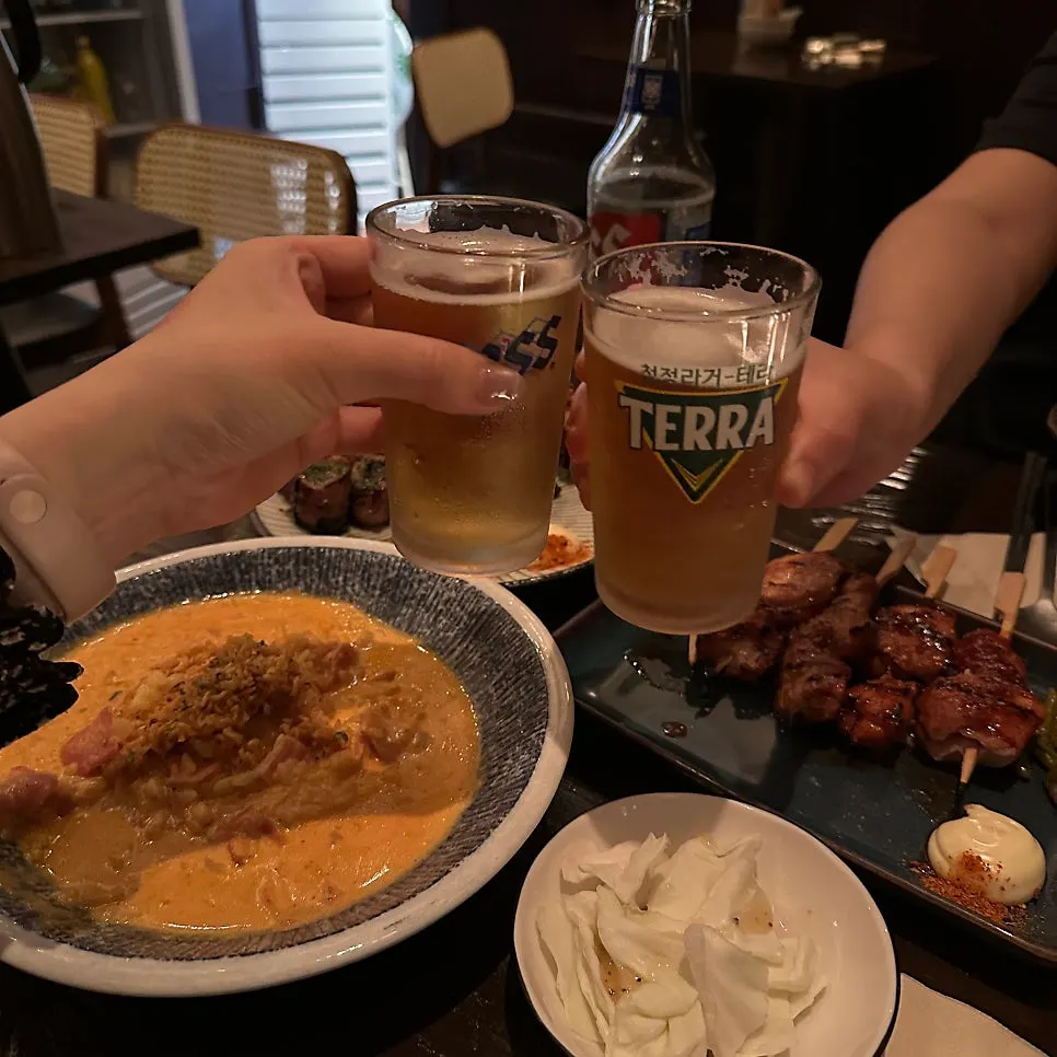 A generously laid out izakaya drinking table