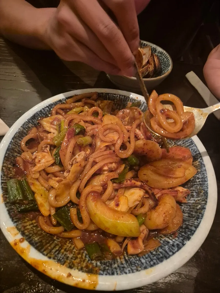 A bowl of spicy seafood yaki udon loaded with seafood