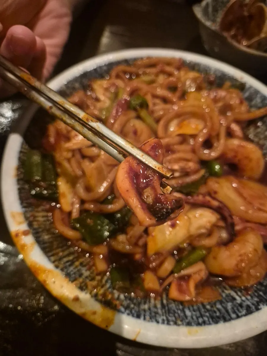 Spicy seafood yaki udon with a big piece of shrimp