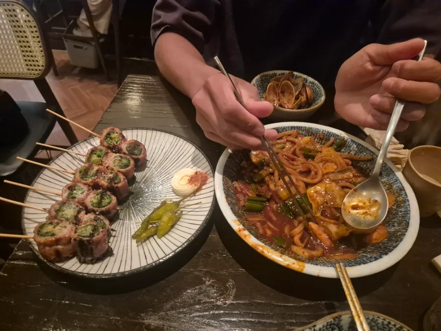 Pork belly scallion skewers served last