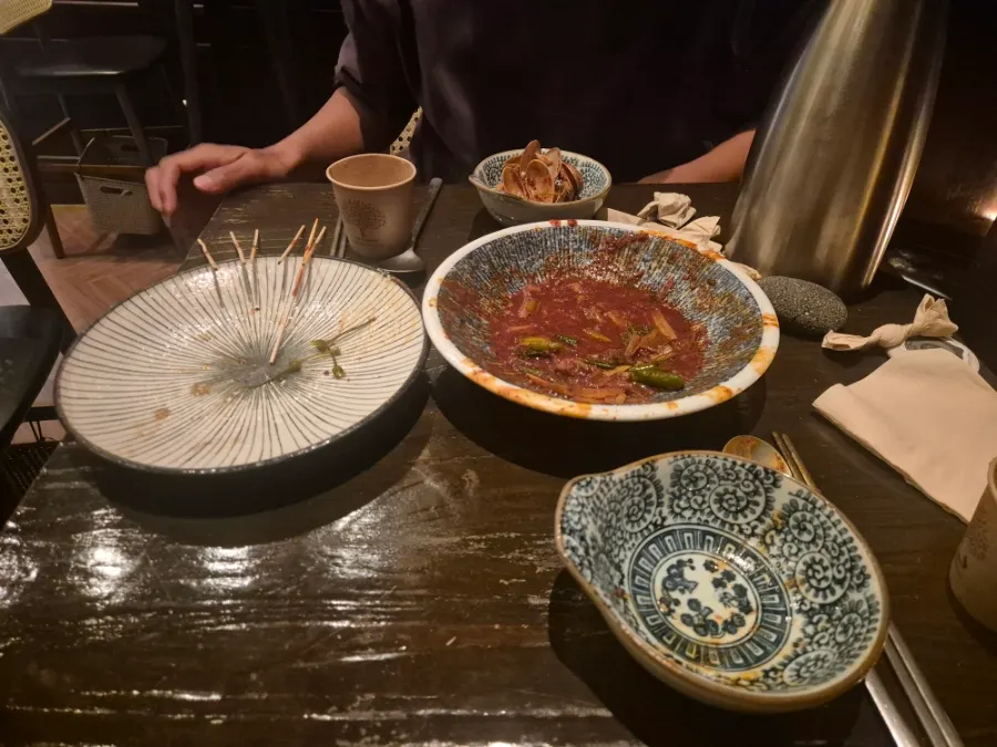 Empty skewer and udon plates after the two of us finished eating
