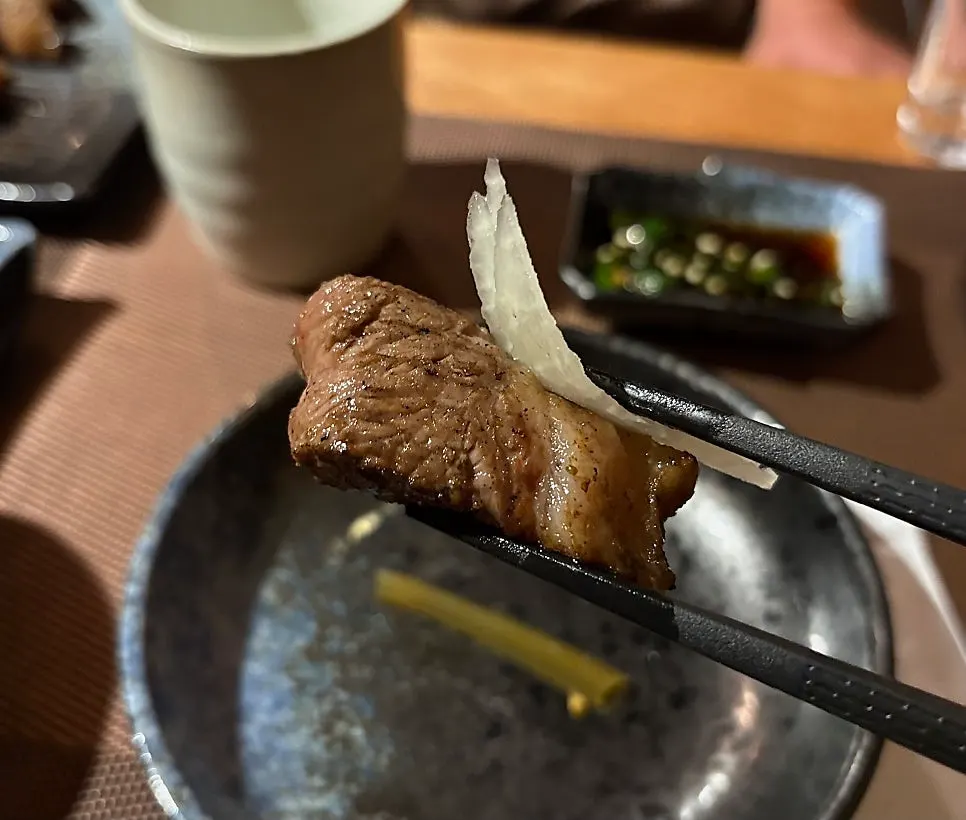 Grilled lamb placed on a small plate