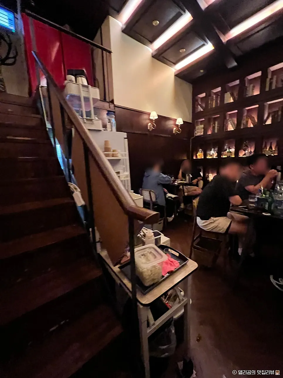 Table seating on the right side of the first floor at Nani Byeolgwan