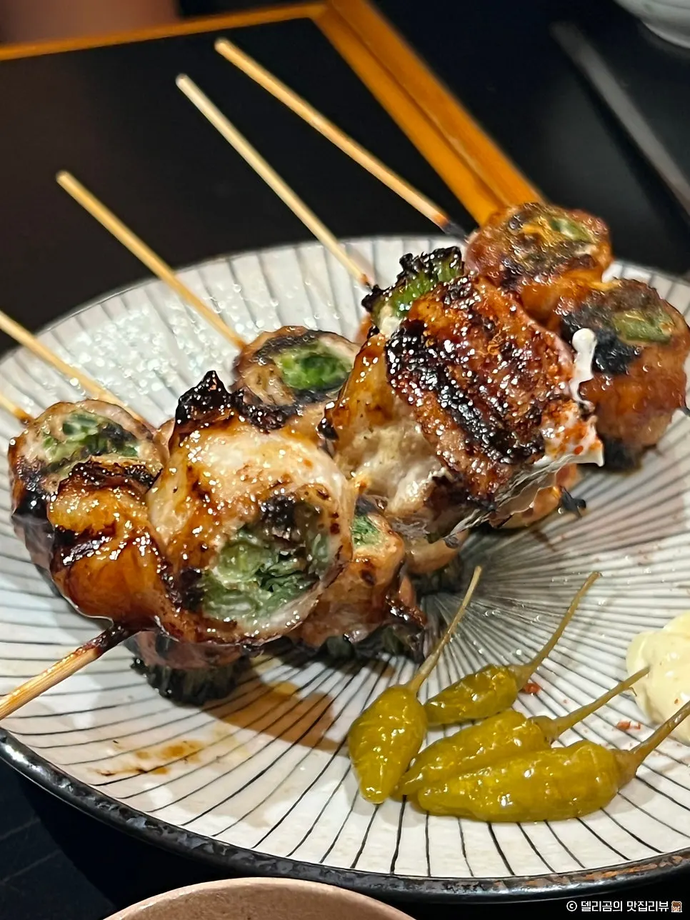 Pork belly scallion skewers with mayo sauce and shichimi
