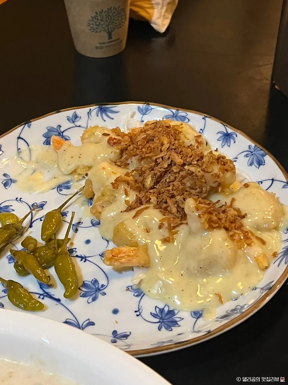 Lemon cream shrimp topped with fried onion
