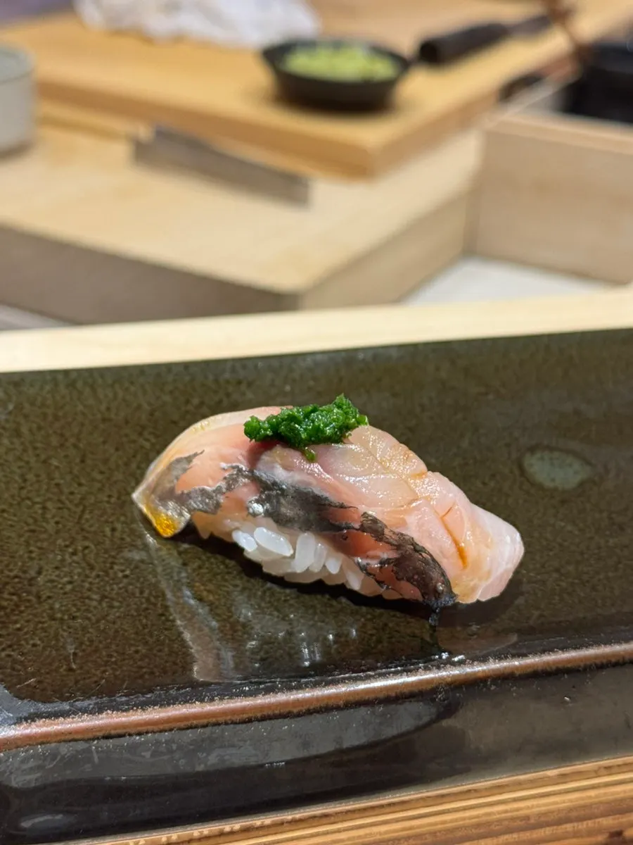 Horse mackerel nigiri topped with scallion sauce