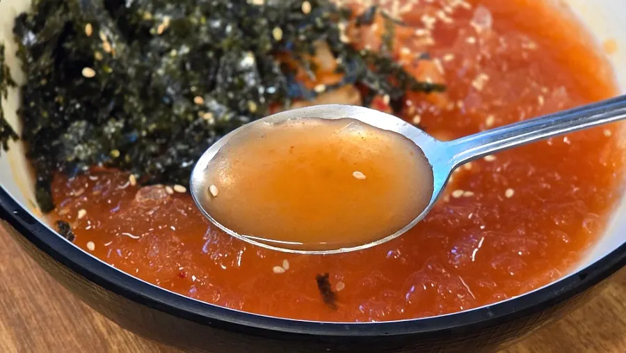 A bowl of tangy kimchi rolled noodles