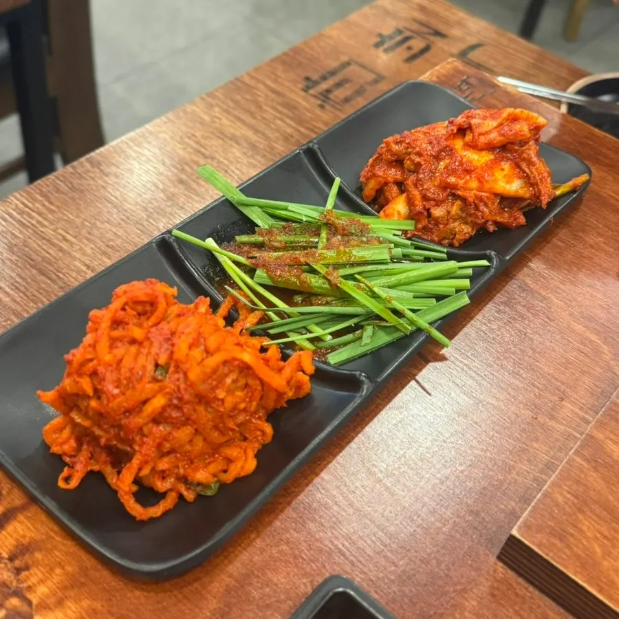 Side dish plates of dried radish kimchi and chive salad