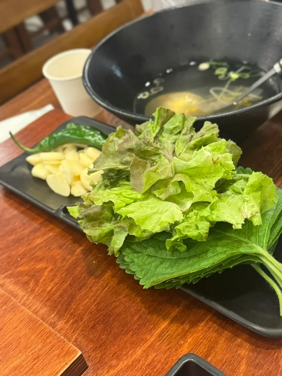 Plate of lettuce wraps, garlic, and chili