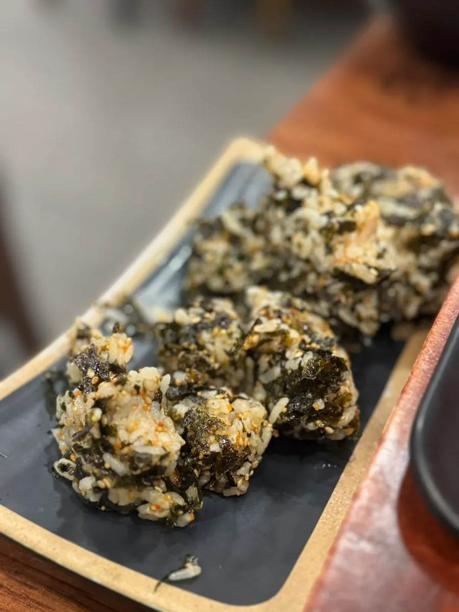 Hand-shaped flying fish roe rice ball