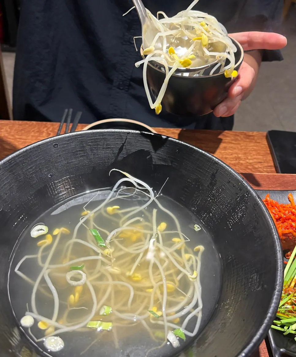 Free-refill bean sprout soup and domestic kimchi
