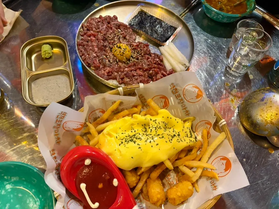 A plate of yukhoe served with a sweet sauce